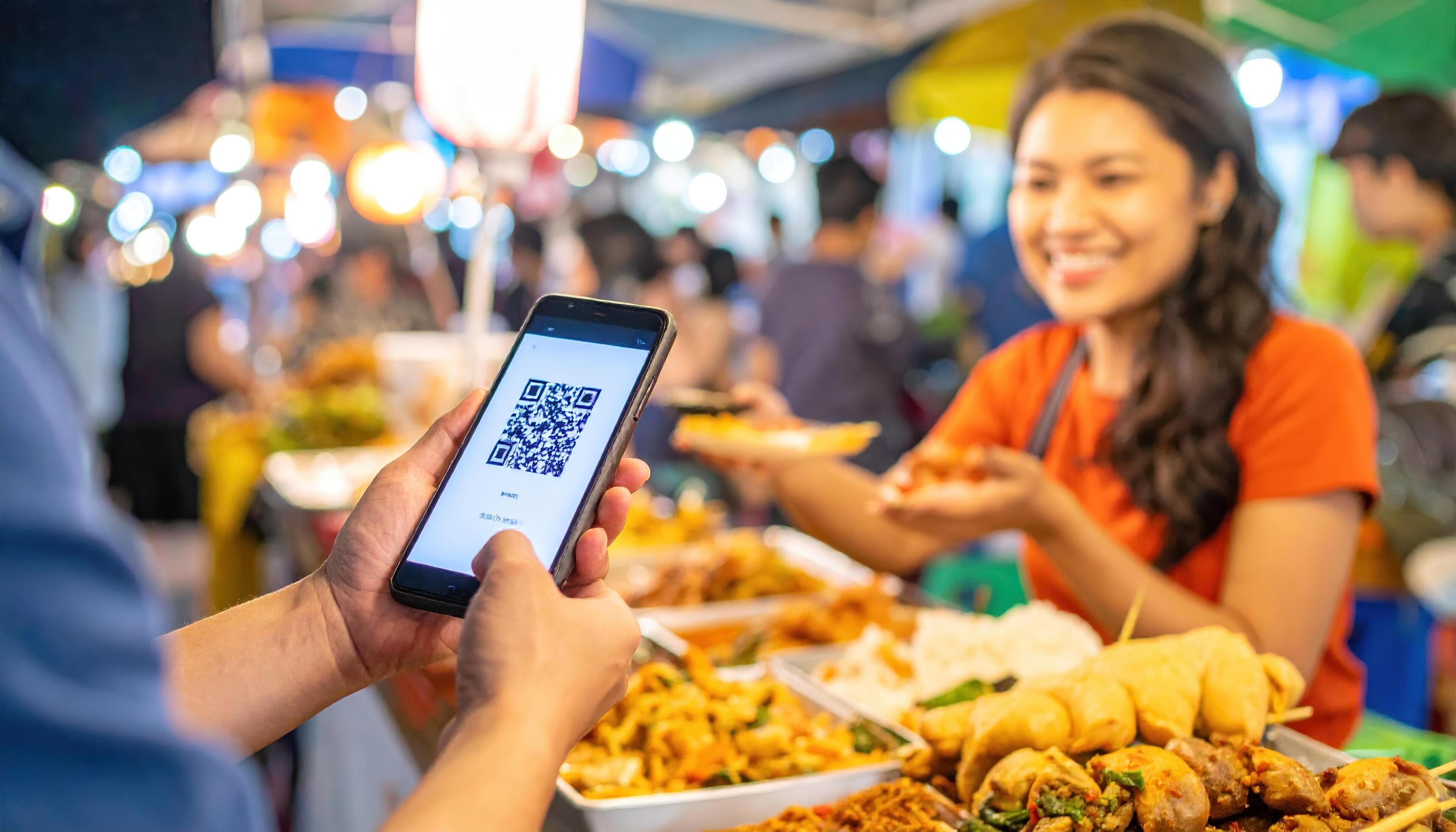 Street vendor in bustling market scanning offline USDC QR code on customer's phone for stablecoin payment without internet, surrounded by fresh produce and happy shoppers boosting sales